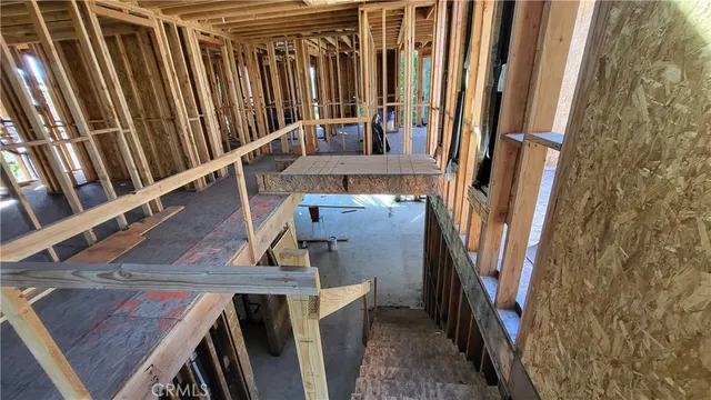 a view of a room with large windows