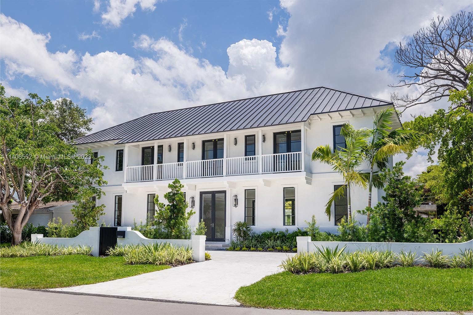 5500 Southwest 74th Street Miami, FL 33143 - Photo 1 of 31 a front view of a house with a yard