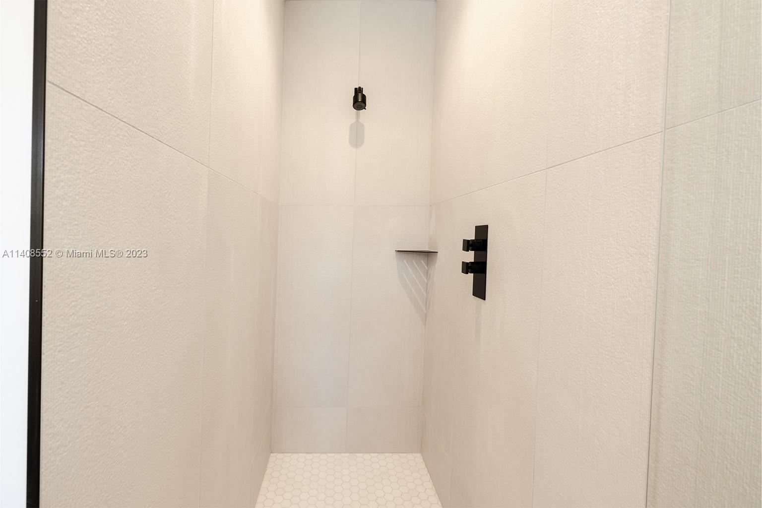 5500 Southwest 74th Street Miami, FL 33143 - Photo 16 of 31 a bathroom with a shower