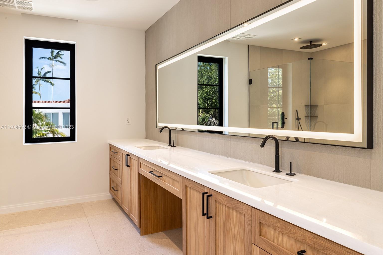 5500 Southwest 74th Street Miami, FL 33143 - Photo 20 of 31 a bathroom with a sink and a mirror