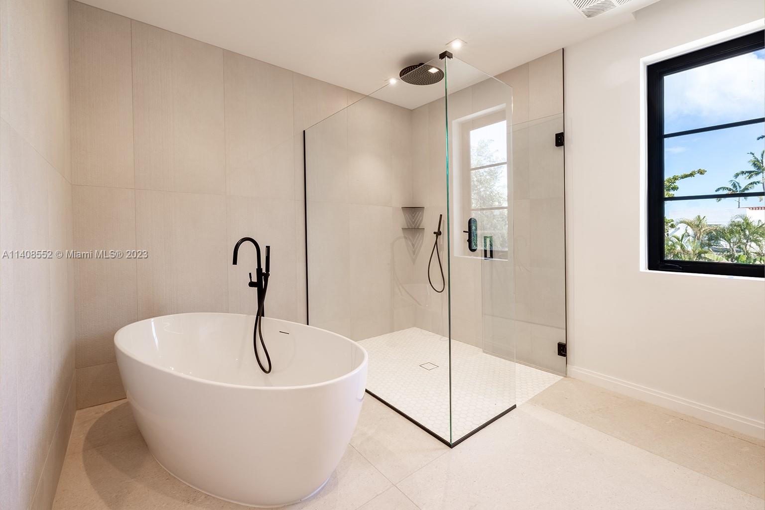 5500 Southwest 74th Street Miami, FL 33143 - Photo 22 of 31 a white bath tub sitting next to a shower