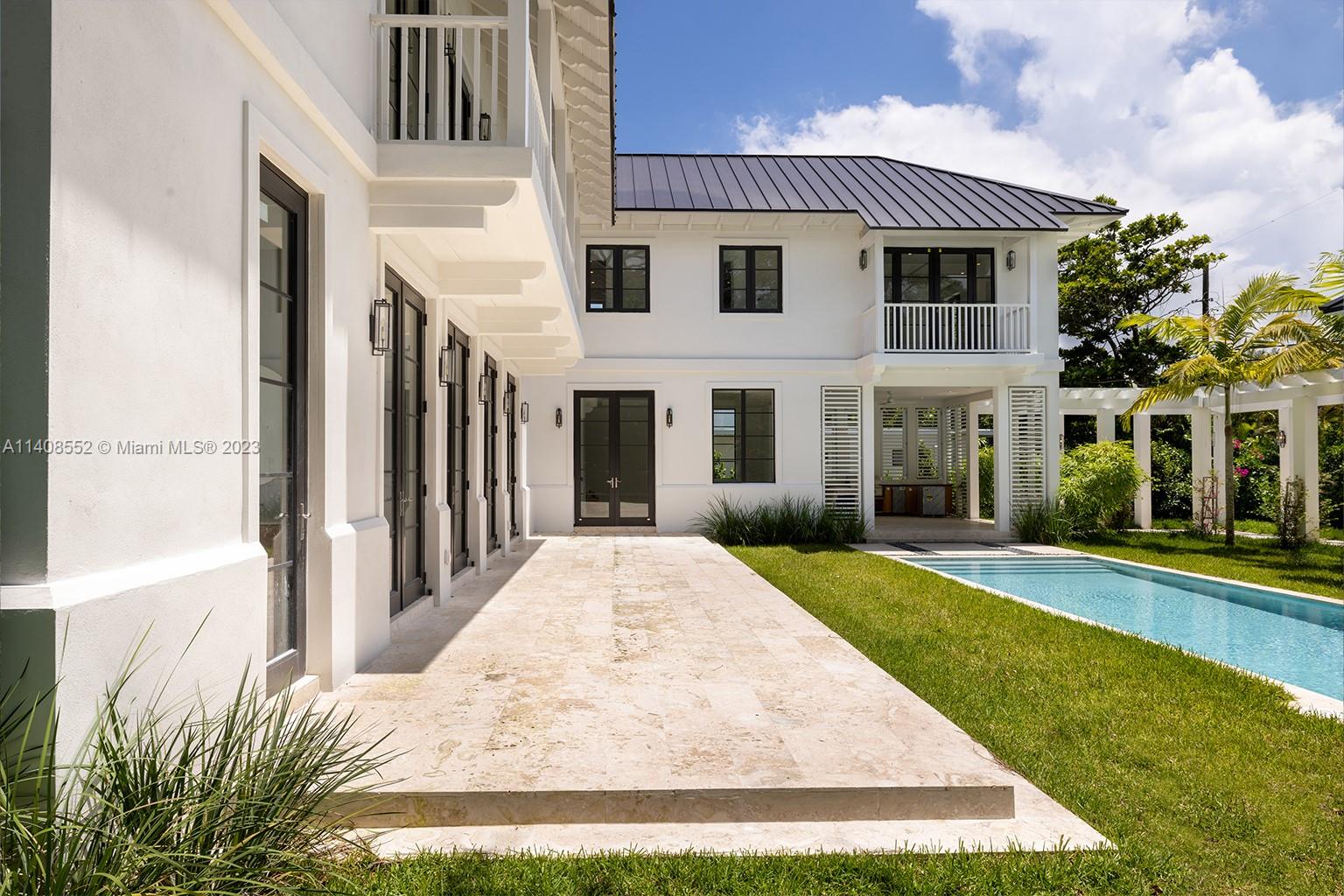 5500 Southwest 74th Street Miami, FL 33143 - Photo 26 of 31 a front view of a house with garden