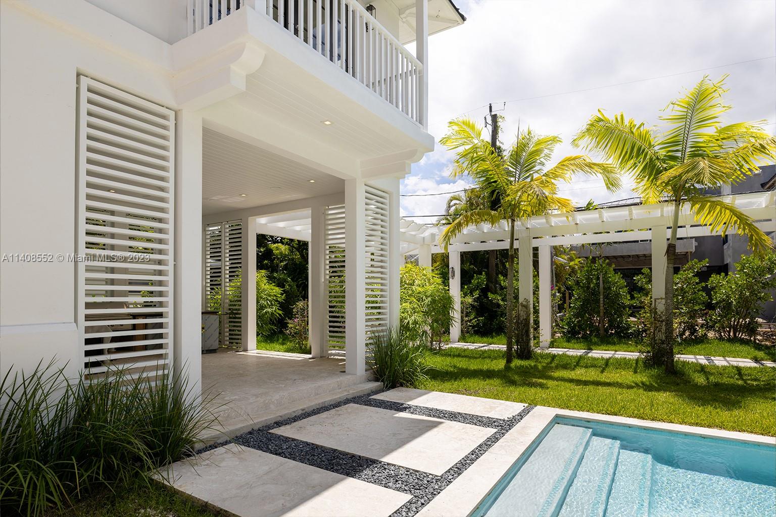 5500 Southwest 74th Street Miami, FL 33143 - Photo 27 of 31 a view of a house with a yard