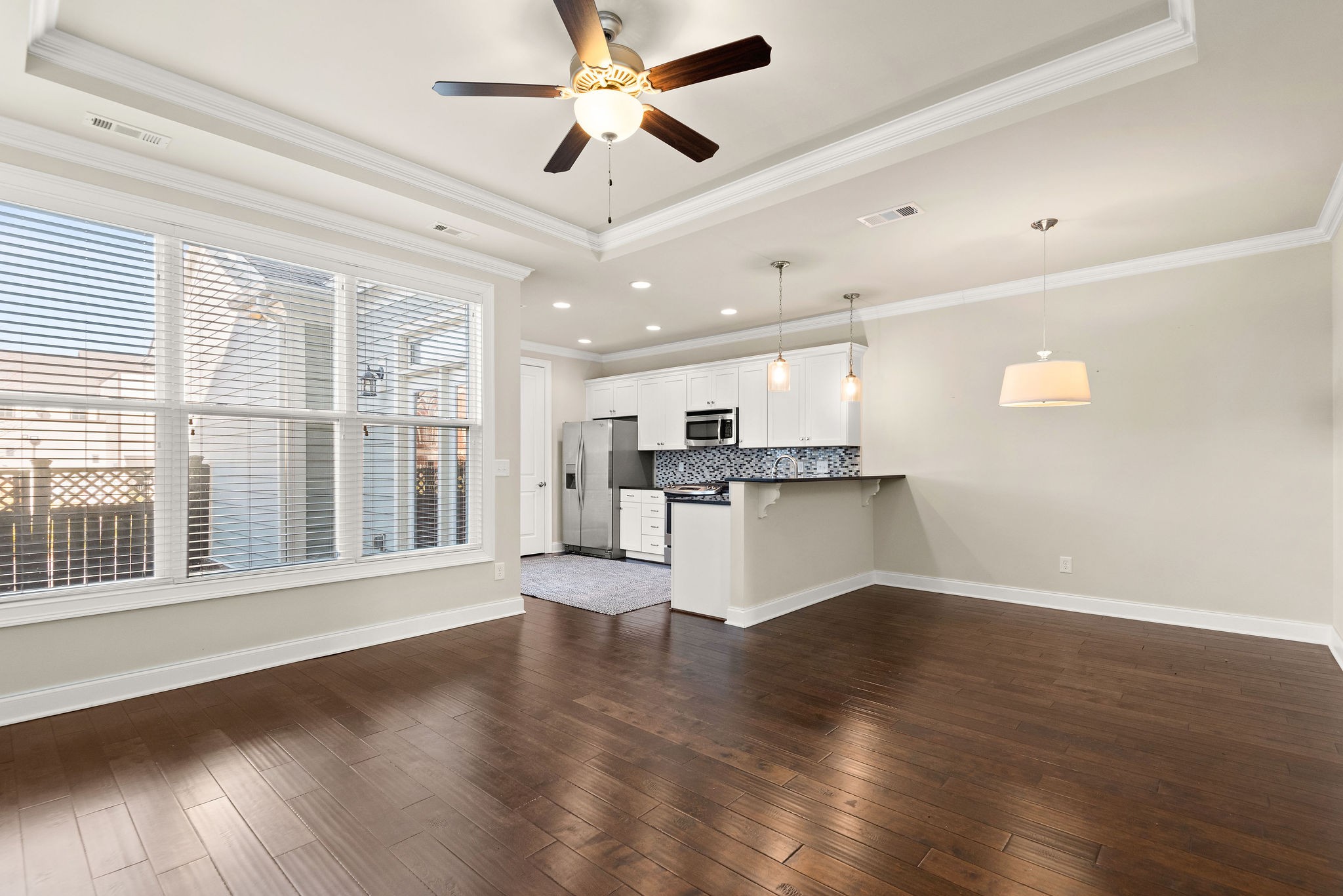 1031 Howland Street Franklin, TN 37064 - Photo 11 of 69 a view of an empty room with wooden floor and a window
