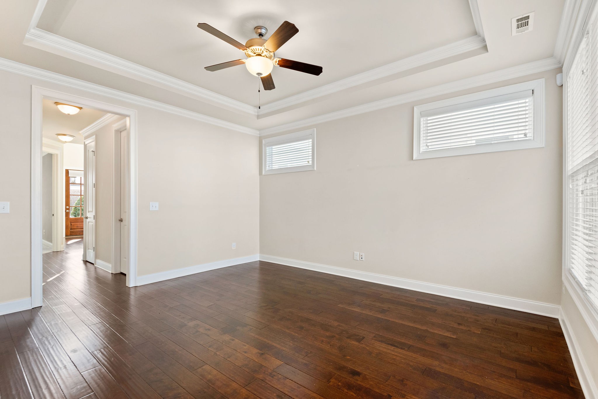 1031 Howland Street Franklin, TN 37064 - Photo 13 of 69 an empty room with wooden floor and windows