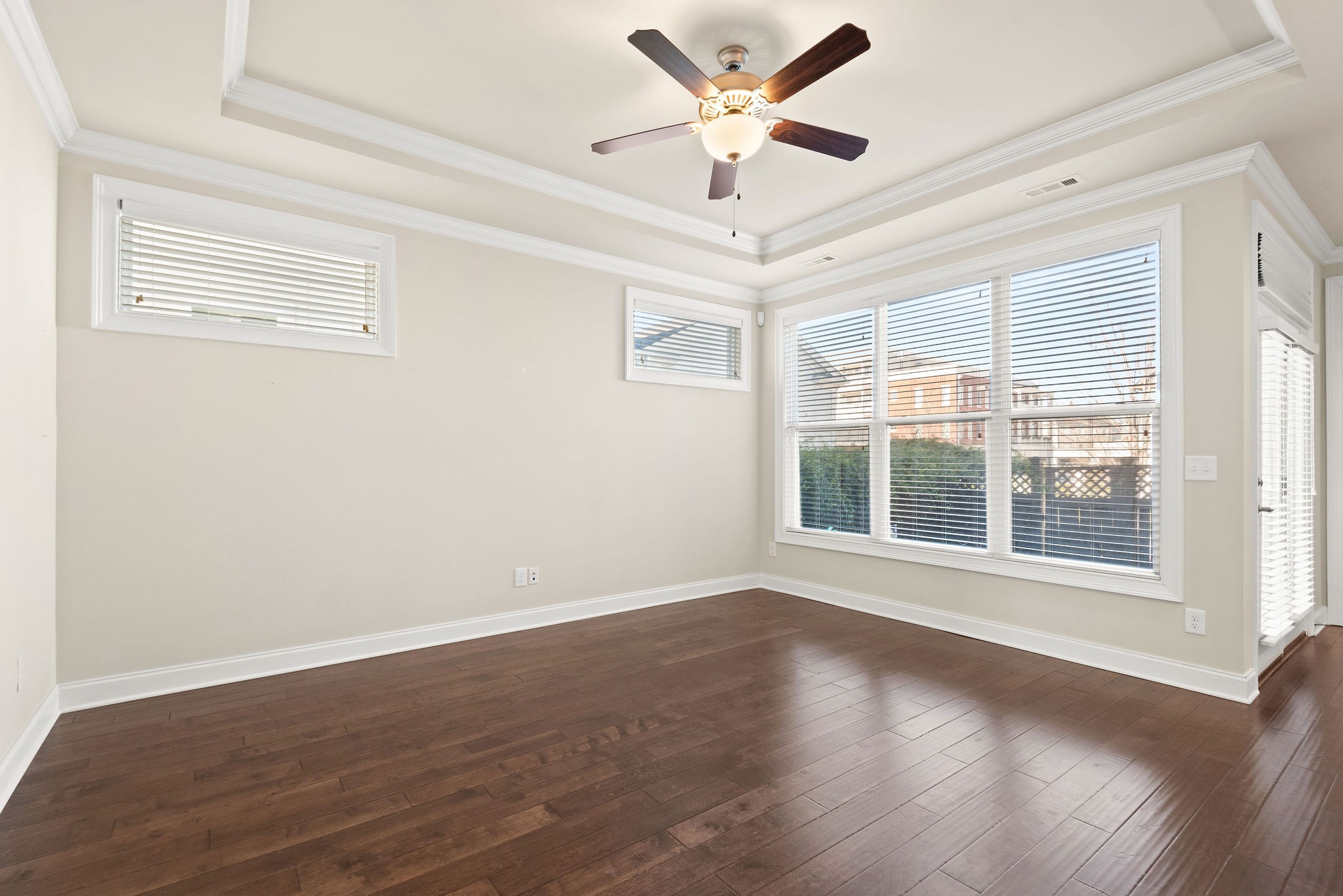 1031 Howland Street Franklin, TN 37064 - Photo 15 of 69 a view of an empty room with wooden floor and a window