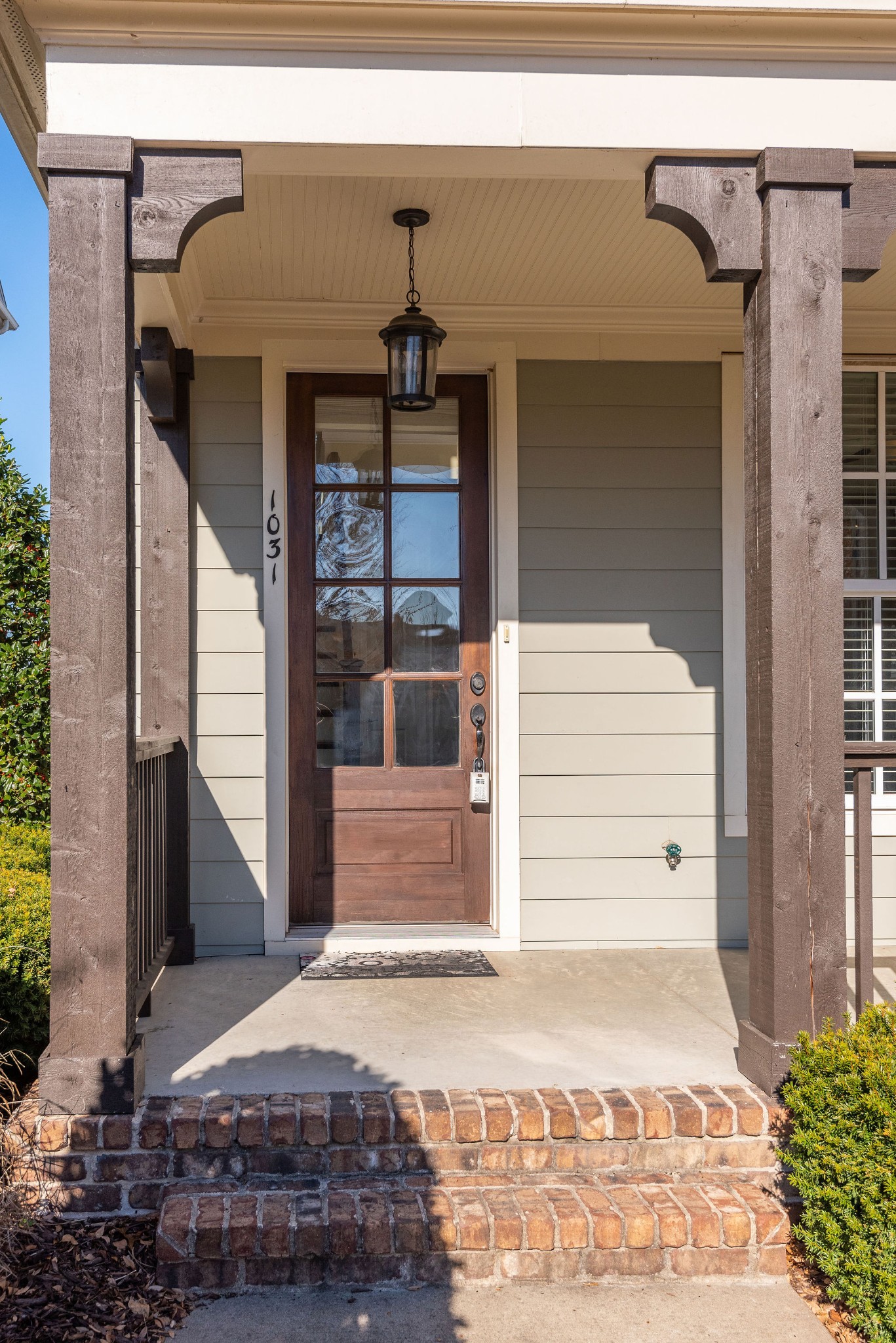 1031 Howland Street Franklin, TN 37064 - Photo 5 of 69 a front view of a house with a garage