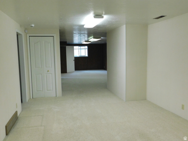 2148 Carolyn Way Bountiful, UT 84010 - Photo 23 of 40 Carpeted room with light-colored walls and a bi-fold door