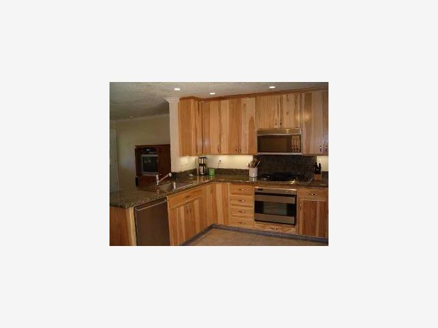 628 Palm Avenue Ripon, CA 95366 - Photo 4 of 10 a kitchen with a refrigerator stove and microwave
