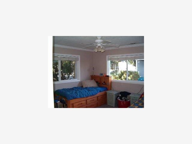 628 Palm Avenue Ripon, CA 95366 - Photo 8 of 10 a living room with furniture and a potted plant