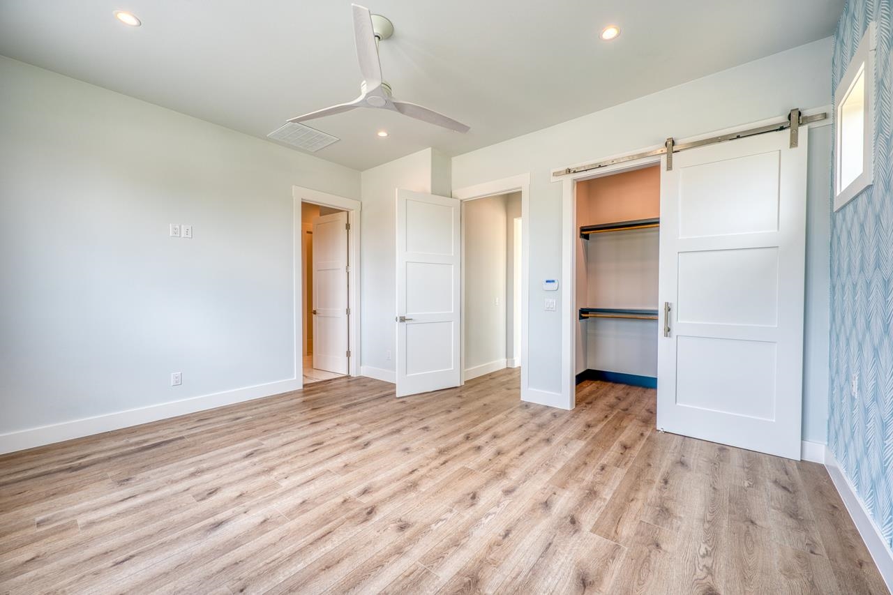 320 Lake Street Kingsland, TX 78639 - Photo 11 of 30 a view of empty room with wooden floor and window