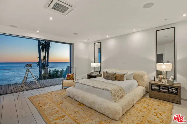 a view of balcony with wooden floor and fence