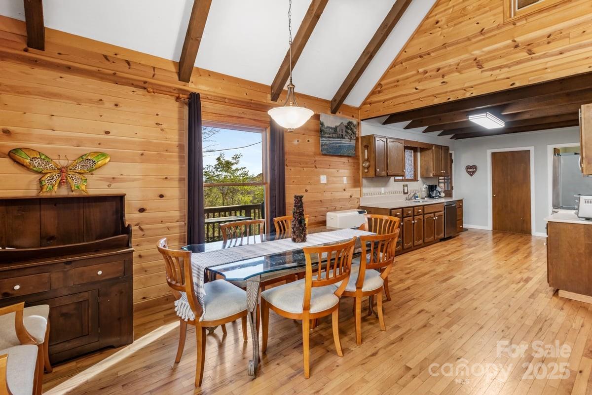 563 Bee Tree Lane Mars Hill, NC 28754 - Photo 5 of 28 a dining room with a wooden table and chairs