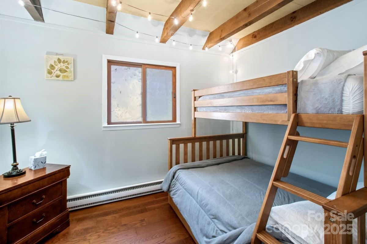 563 Bee Tree Lane Mars Hill, NC 28754 - Photo 9 of 28 a bedroom with a bed and a window