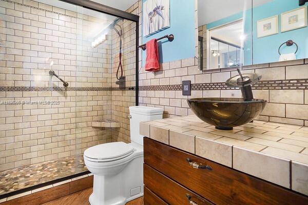 1605 Highway 1, Unit 403M3 Jupiter, FL 33477 - Photo 11 of 18 a bathroom with a toilet and a sink