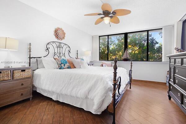 1605 Highway 1, Unit 403M3 Jupiter, FL 33477 - Photo 4 of 18 a bedroom with a bed and a chandelier