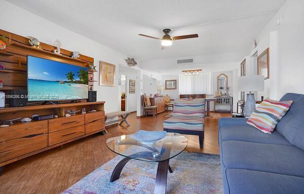 1605 Highway 1, Unit 403M3 Jupiter, FL 33477 - Photo 6 of 18 a living room with furniture and a flat screen tv