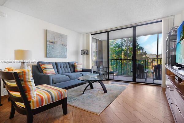 1605 Highway 1, Unit 403M3 Jupiter, FL 33477 - Photo 7 of 18 a living room with furniture and a large window