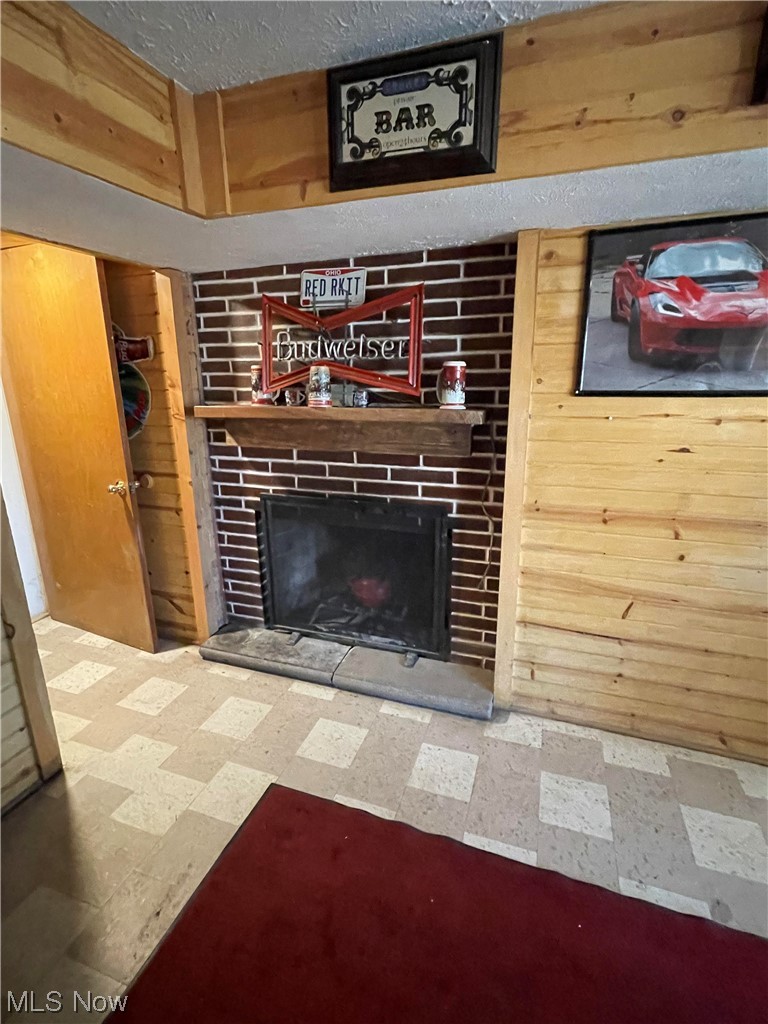 120 Trease Road Wadsworth, OH 44281 - Photo 31 of 35 Basement mancave with fireplace