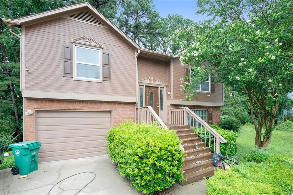 2422 Corner Shoals Drive Decatur, GA 30034 - Photo 1 of 1 a front view of a house with garden