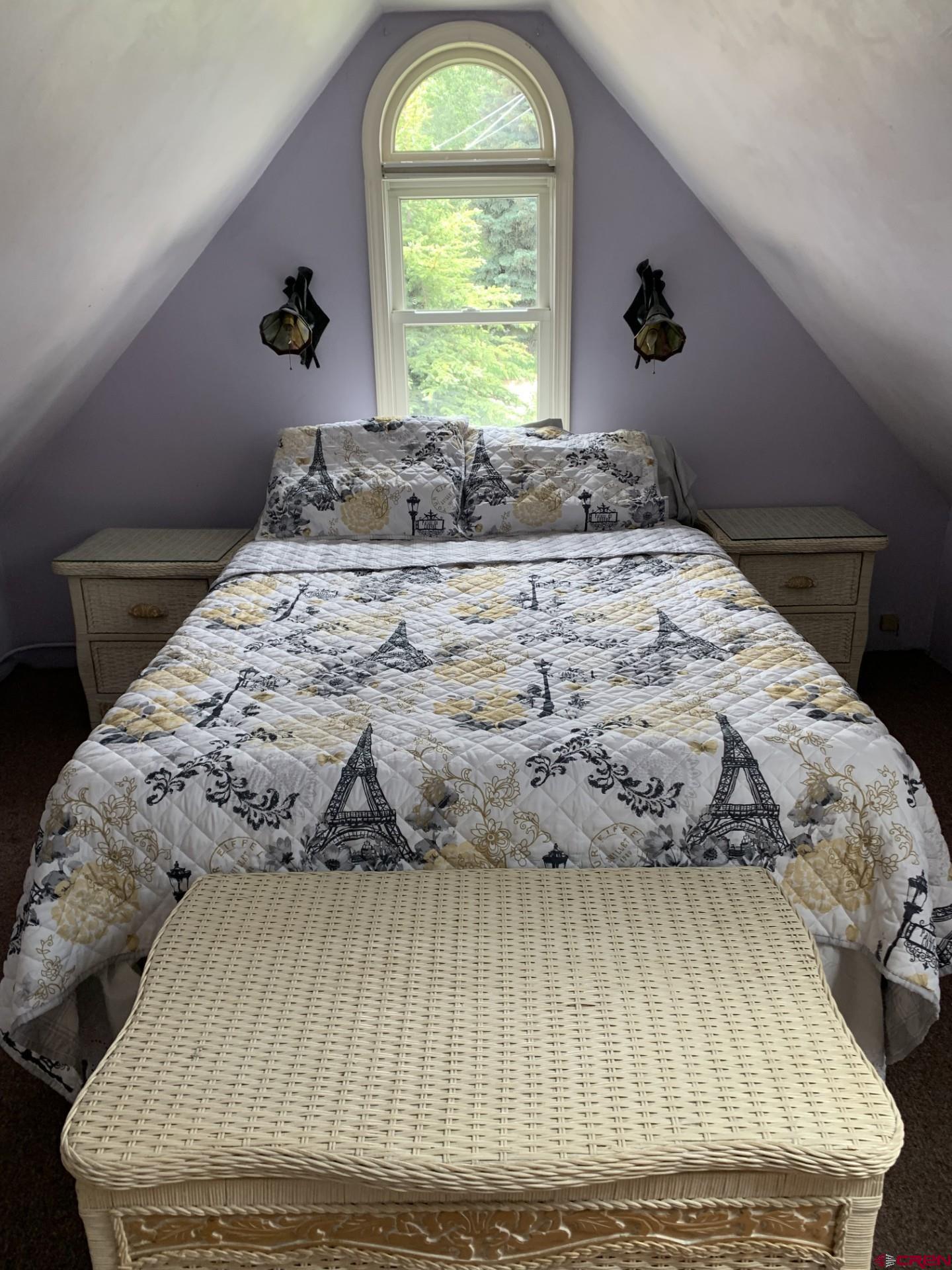 428 Elk Avenue, Unit B Crested Butte, CO 81224 - Photo 5 of 8 a bedroom with a bed and a window