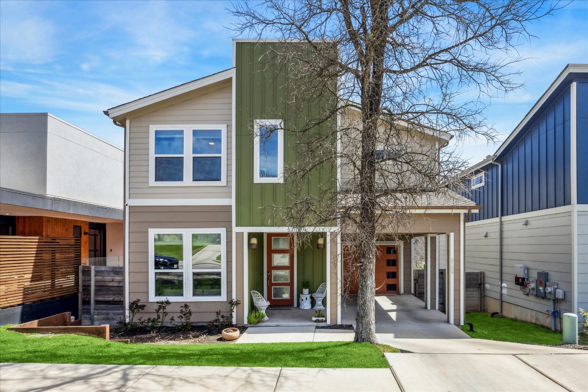 front view of a house with a yard