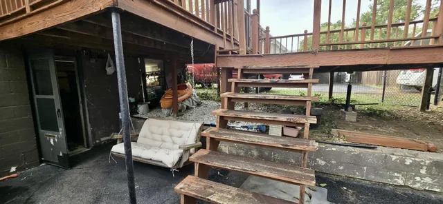 a view of a chairs and a table in the patio