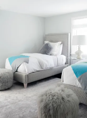 a bed room with two bed and a couch