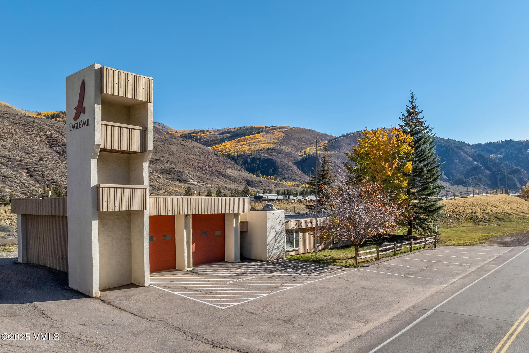 249 Eagle Road Eagle-Vail, CO 81620 - Photo 2 of 22 a front view of a house with a yard and garage