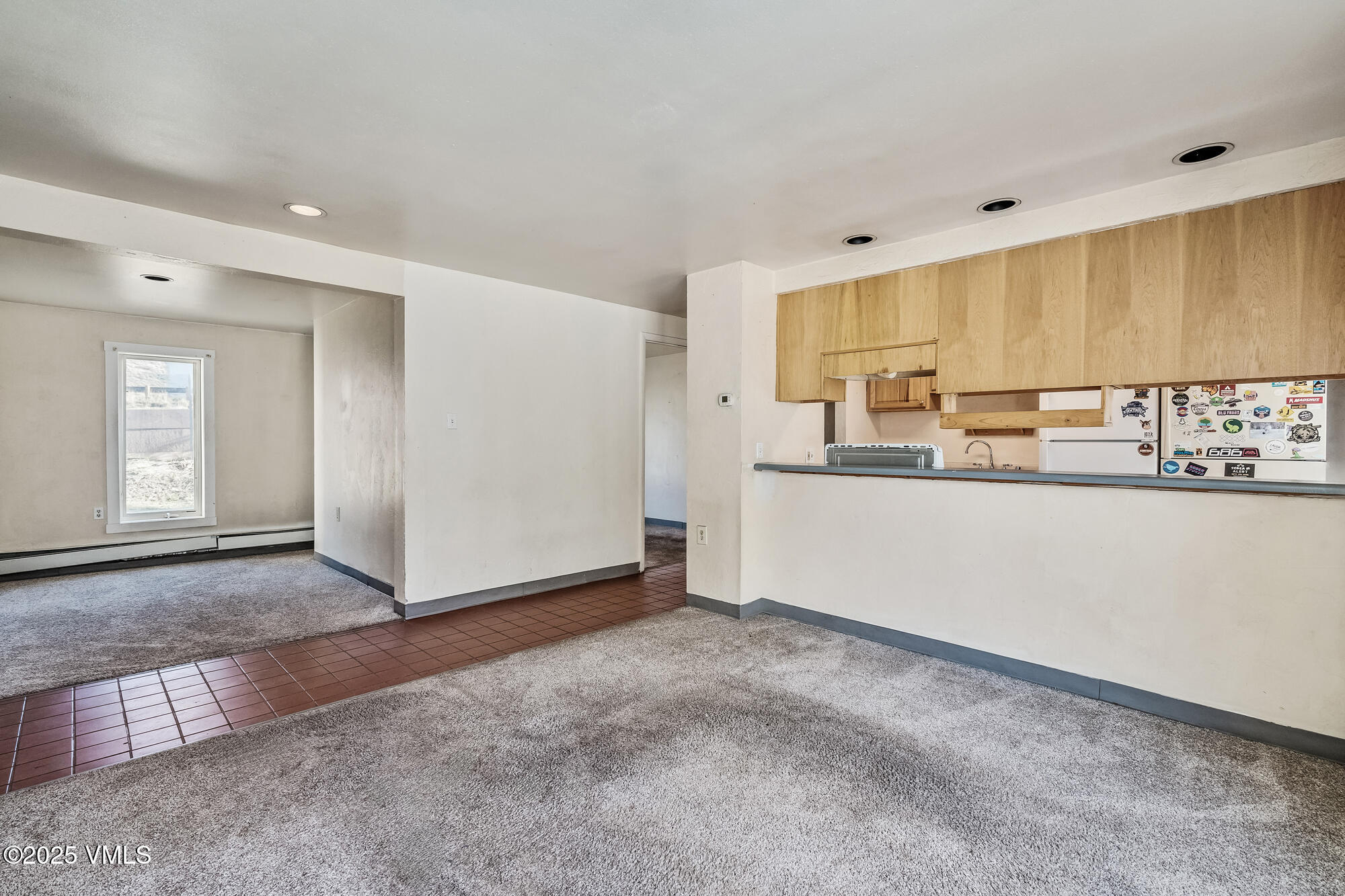 249 Eagle Road Eagle-Vail, CO 81620 - Photo 9 of 22 a view of kitchen with granite countertop cabinets and window
