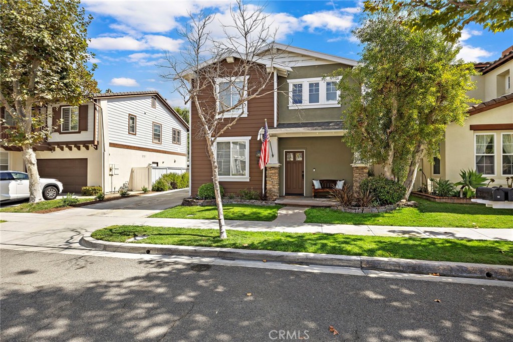 16 Skywood Street Ladera Ranch, CA 92694 - Photo 26 of 36 a front view of a house with a yard and garage