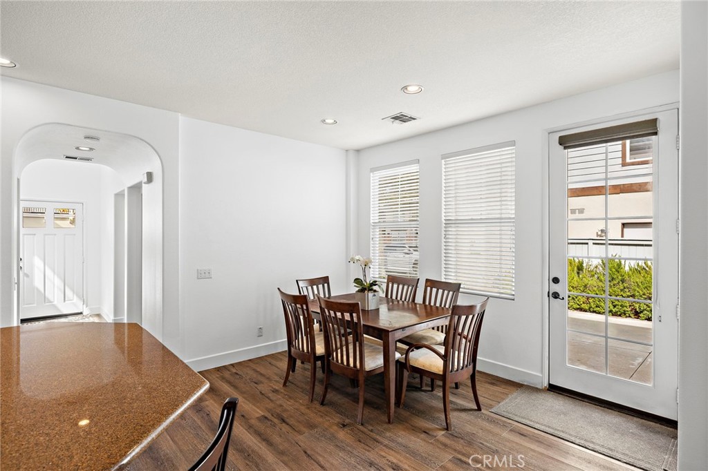 16 Skywood Street Ladera Ranch, CA 92694 - Photo 9 of 36 a view of a dining room with furniture and wooden floor