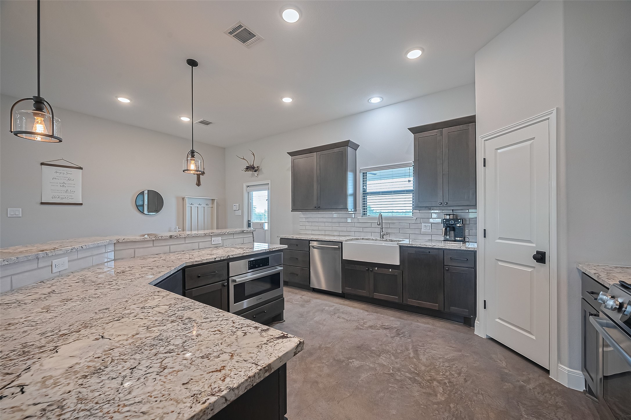 16702 Dipple Road Guy, TX 77444 - Photo 11 of 50 a large kitchen with a large counter top appliances and cabinets