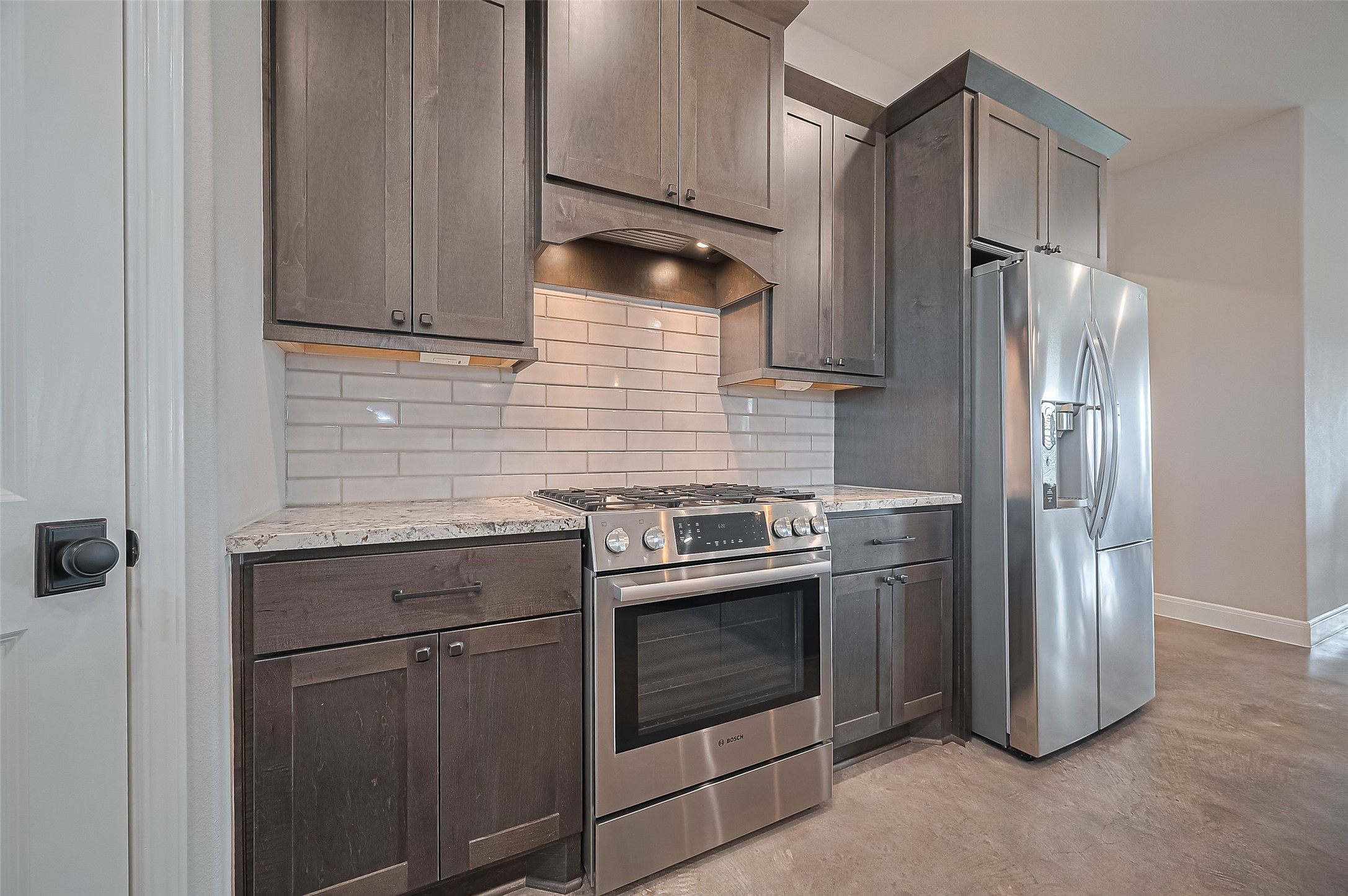 16702 Dipple Road Guy, TX 77444 - Photo 12 of 50 a kitchen with stainless steel appliances granite countertop a refrigerator and a sink