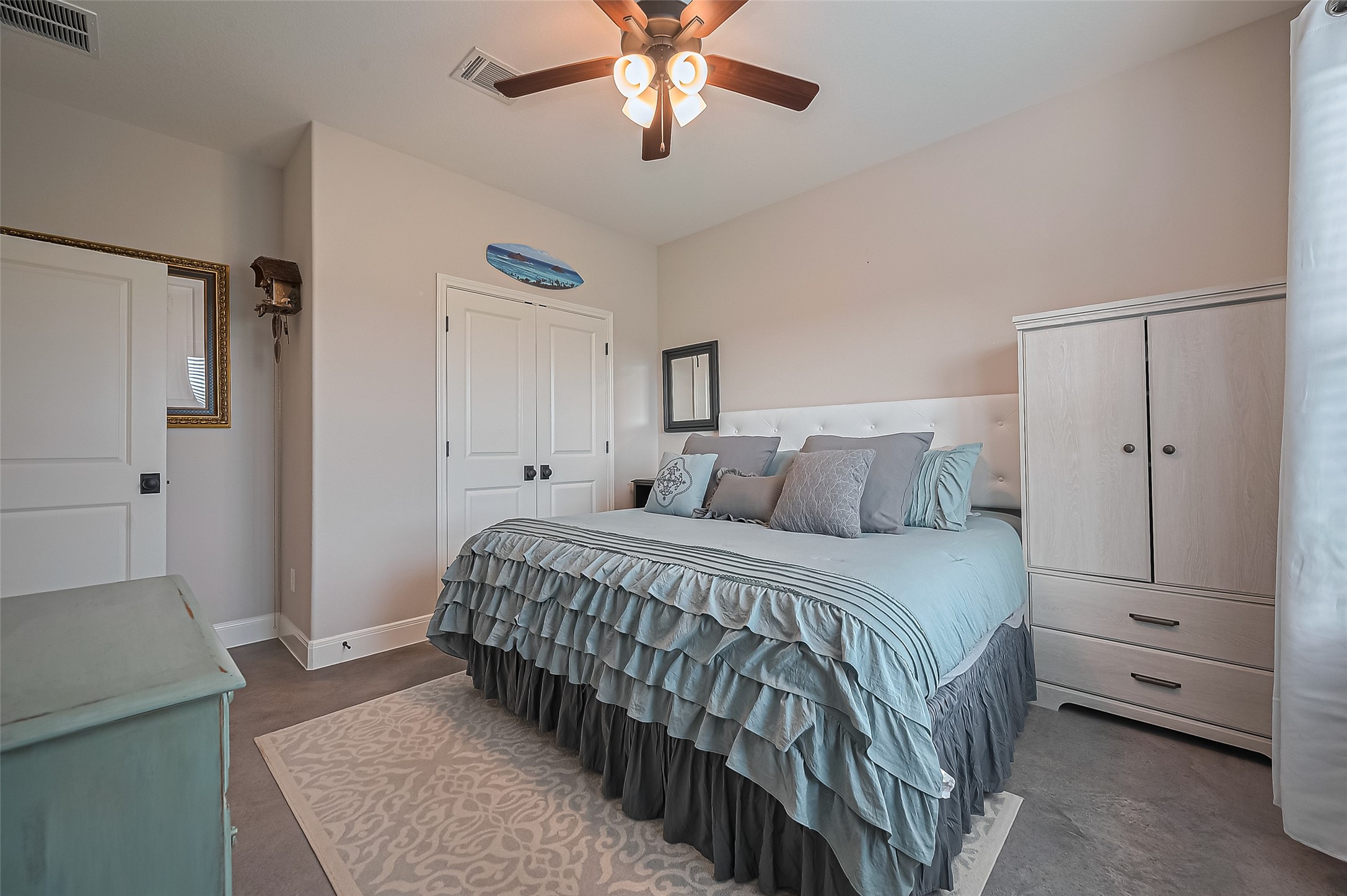 16702 Dipple Road Guy, TX 77444 - Photo 20 of 50 a bedroom with a bed and a ceiling fan