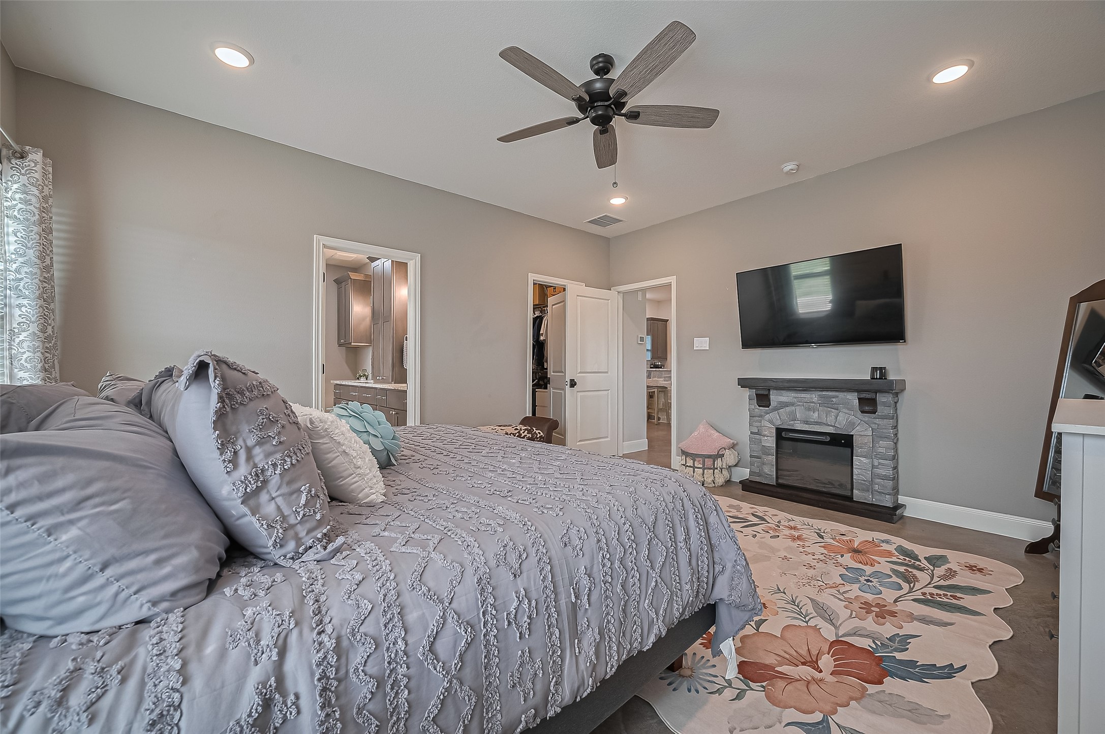 16702 Dipple Road Guy, TX 77444 - Photo 25 of 50 a bedroom with a large bed and a flat screen tv