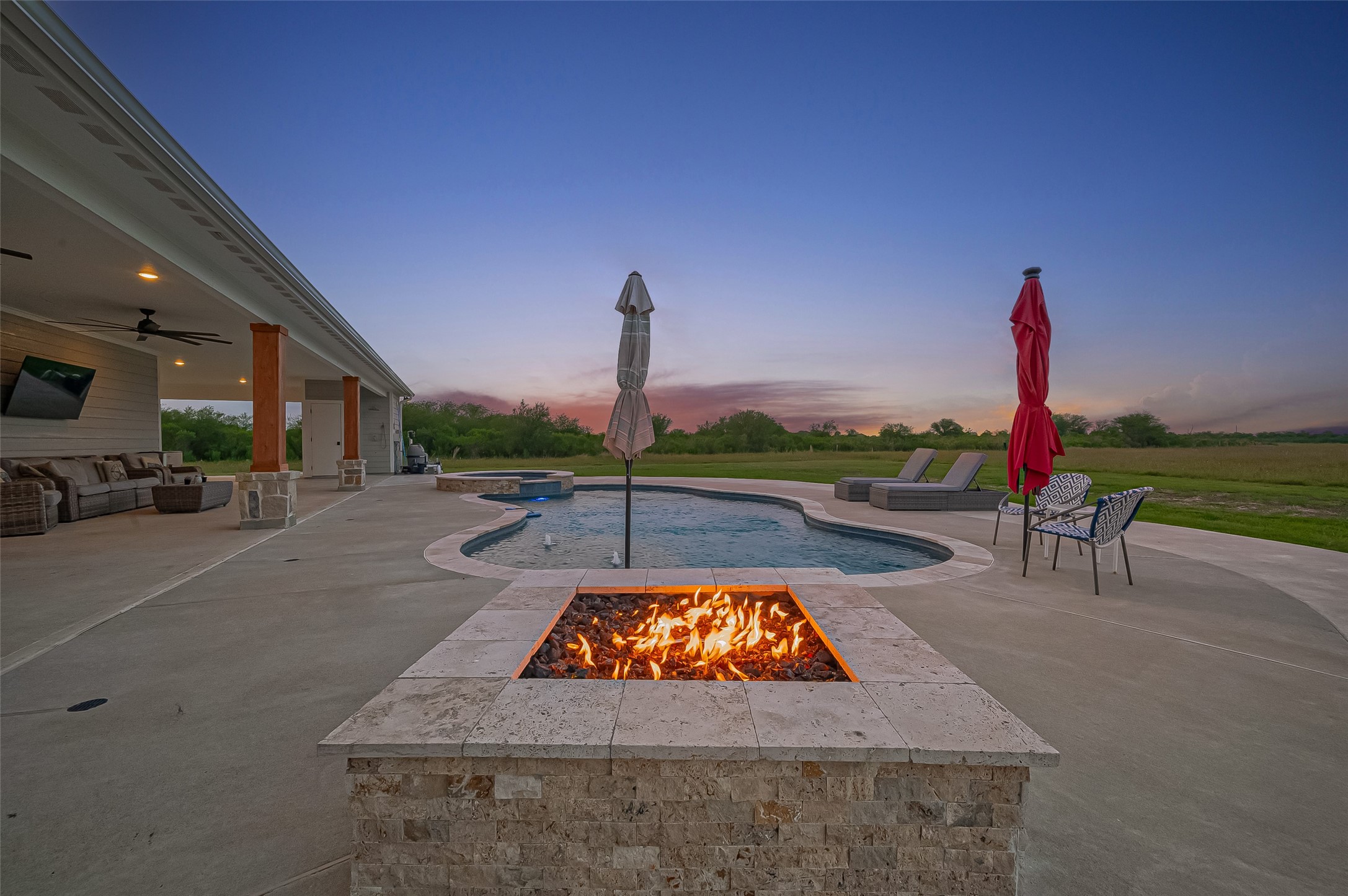 16702 Dipple Road Guy, TX 77444 - Photo 42 of 50 a view of a swimming pool with a lounge chair