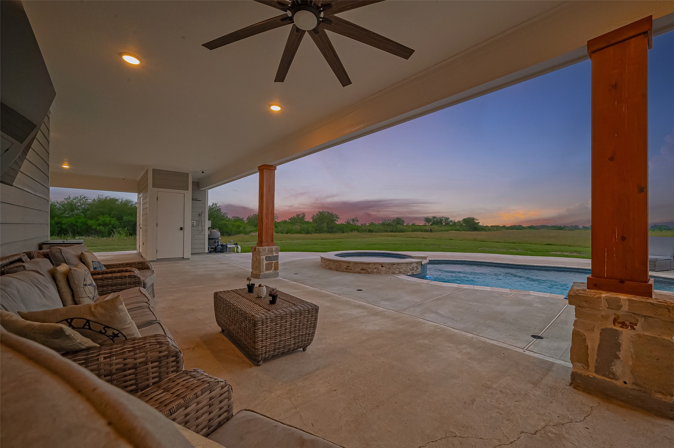 16702 Dipple Road Guy, TX 77444 - Photo 43 of 50 a living room with furniture and a floor to ceiling window