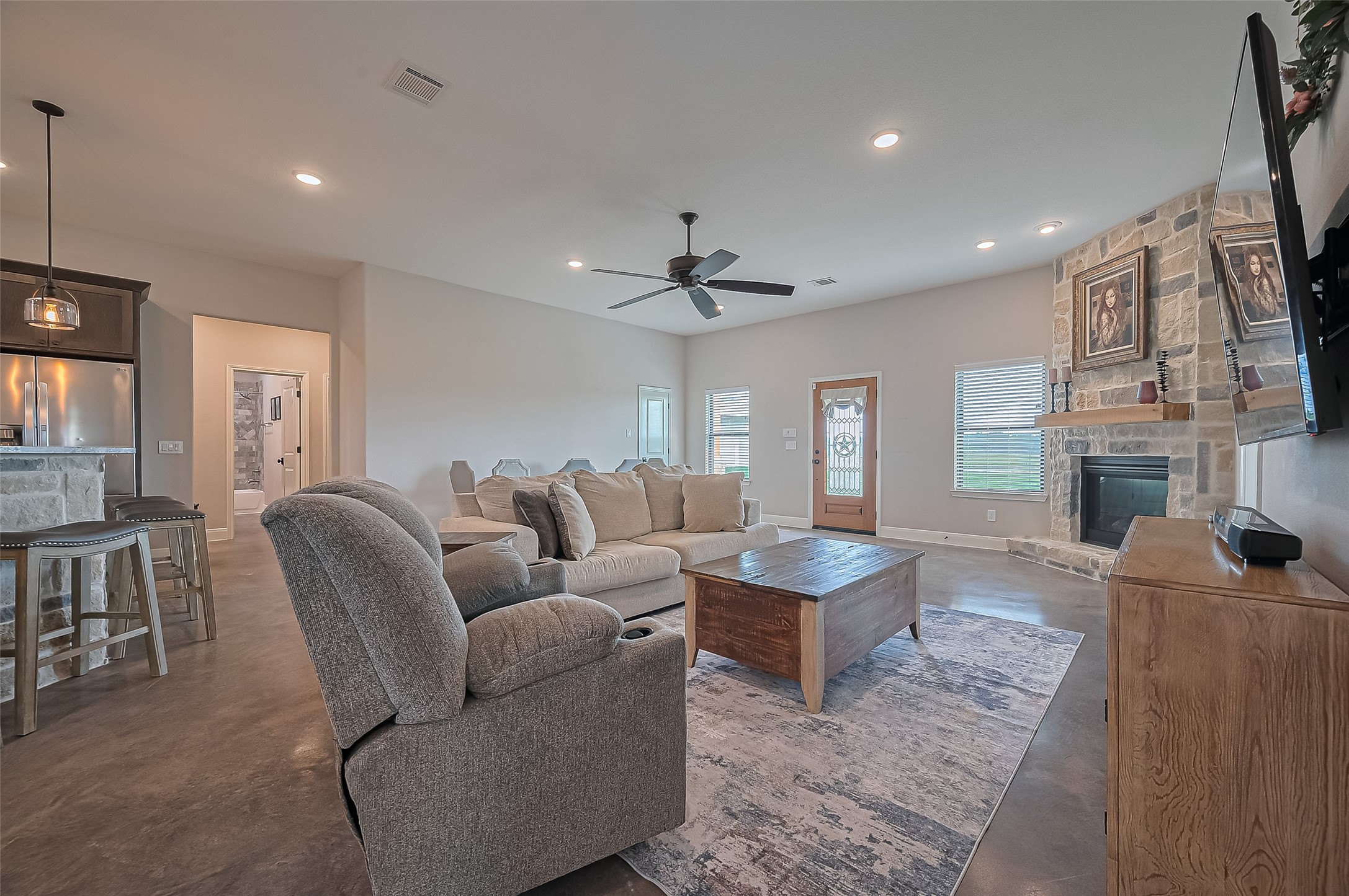 16702 Dipple Road Guy, TX 77444 - Photo 7 of 50 a living room with furniture and a fireplace