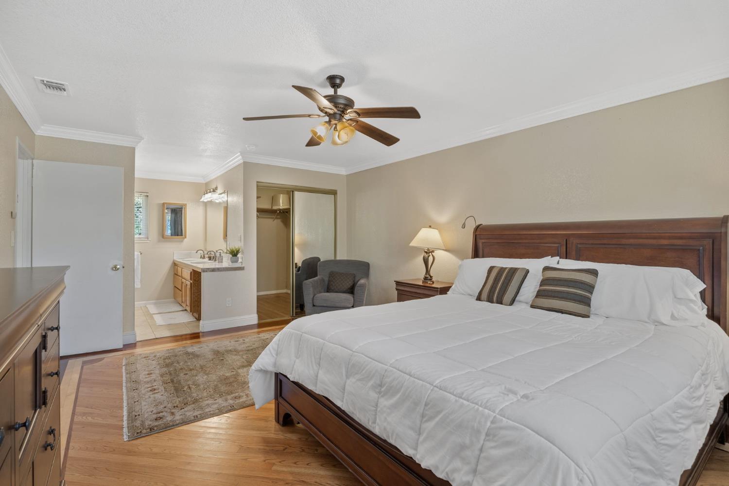 4206 Zephyr Way Sacramento, CA 95821 - Photo 26 of 45 a spacious bedroom with a bed and ceiling fan