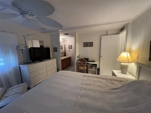 a large white bed in a white room