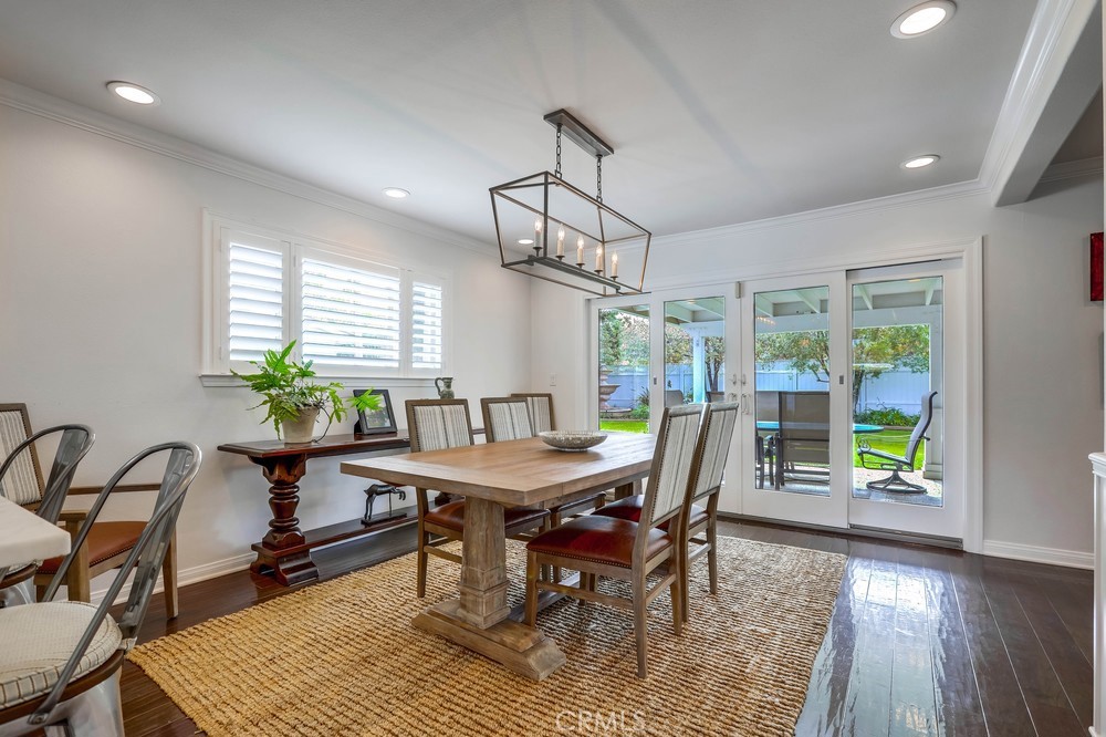 2879 Clubhouse Road Costa Mesa, CA 92626 - Photo 15 of 64 a view of a dining room with furniture window and wooden floor