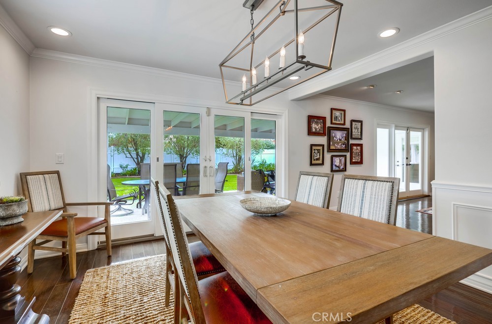 2879 Clubhouse Road Costa Mesa, CA 92626 - Photo 16 of 64 a view of a dining room with furniture window and wooden floor