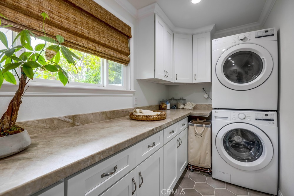 2879 Clubhouse Road Costa Mesa, CA 92626 - Photo 41 of 64 a utility room with sink dryer and washer