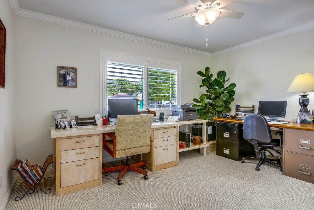 2879 Clubhouse Road Costa Mesa, CA 92626 - Photo 42 of 64 a view of a workspace with furniture and a window