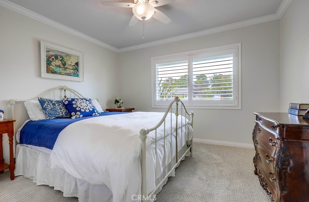 2879 Clubhouse Road Costa Mesa, CA 92626 - Photo 45 of 64 a bed sitting in a bedroom next to a window