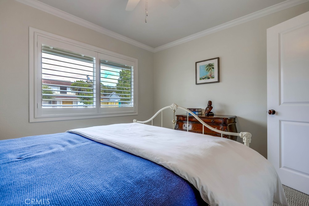 2879 Clubhouse Road Costa Mesa, CA 92626 - Photo 46 of 64 a bedroom with a bed and a window