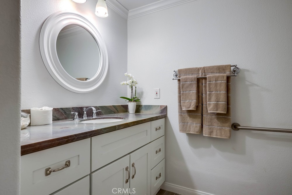 2879 Clubhouse Road Costa Mesa, CA 92626 - Photo 53 of 64 a bathroom with a granite countertop sink a mirror and shower