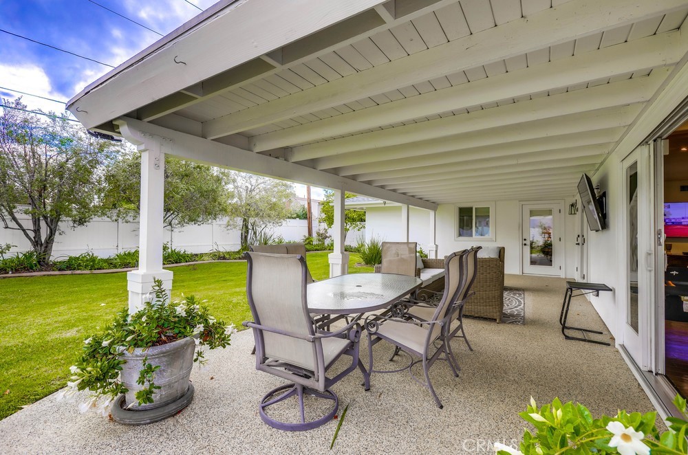 2879 Clubhouse Road Costa Mesa, CA 92626 - Photo 56 of 64 a view of a patio with a table chairs and garden