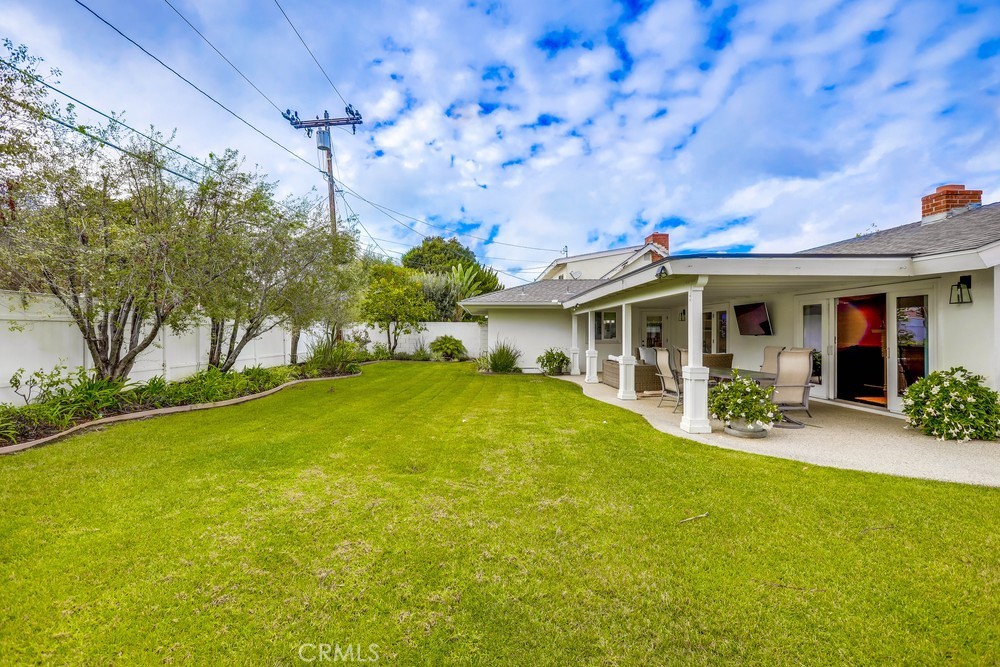 2879 Clubhouse Road Costa Mesa, CA 92626 - Photo 58 of 64 a front view of house with yard and green space